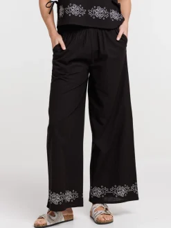 Pantalon femme noir fleurs brodées