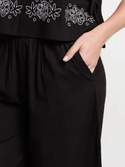 Pantalon femme noir fleurs brodées