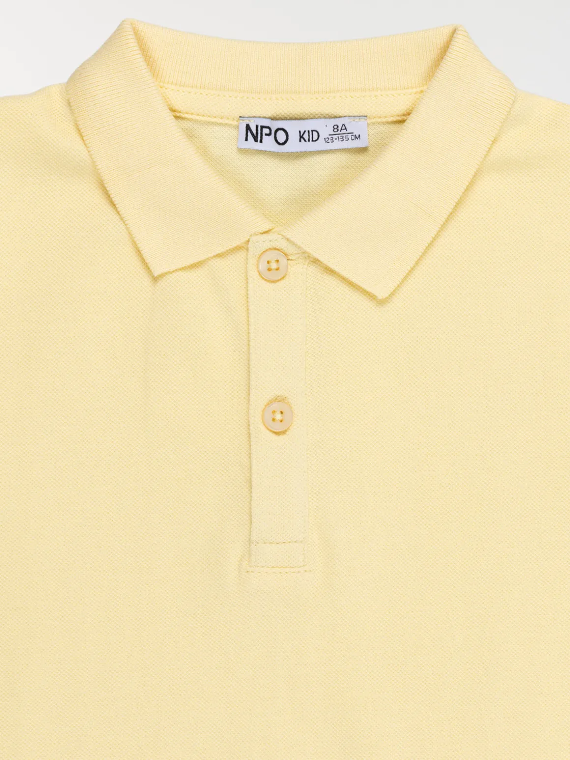 Polo uni jaune doux garçon (3-12A)