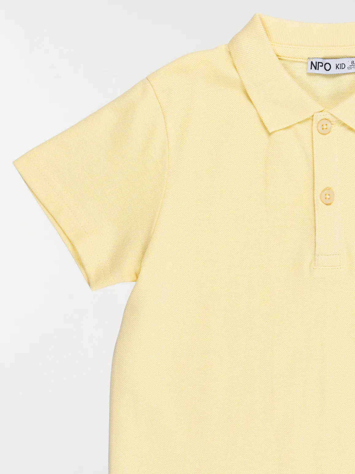 Polo uni jaune doux garçon (3-12A)
